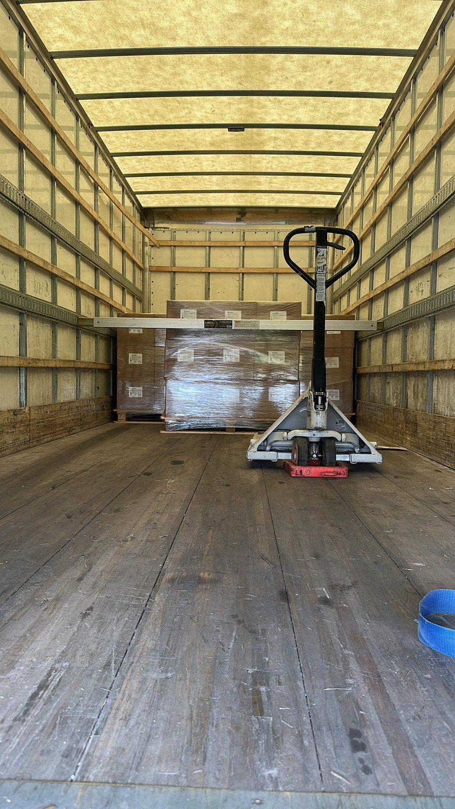 Box truck interior with pallet jack ready for delivery