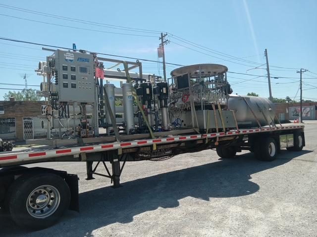 Flatbed trailer loaded with industrial freight